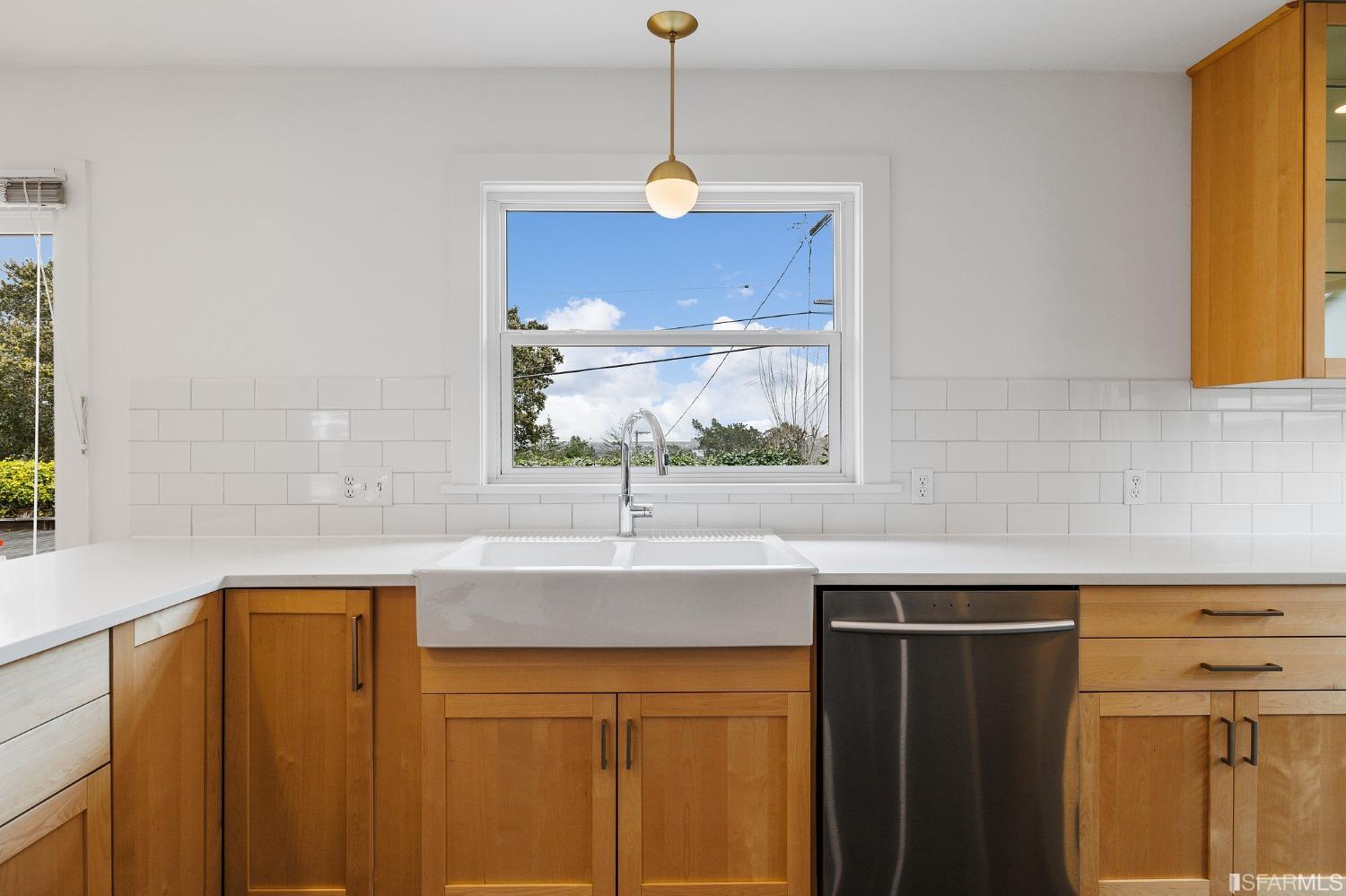 3101 Sunset Terrace San Mateo, CA 94403 - Photo 11 of 24 a kitchen with a sink a window and cabinets