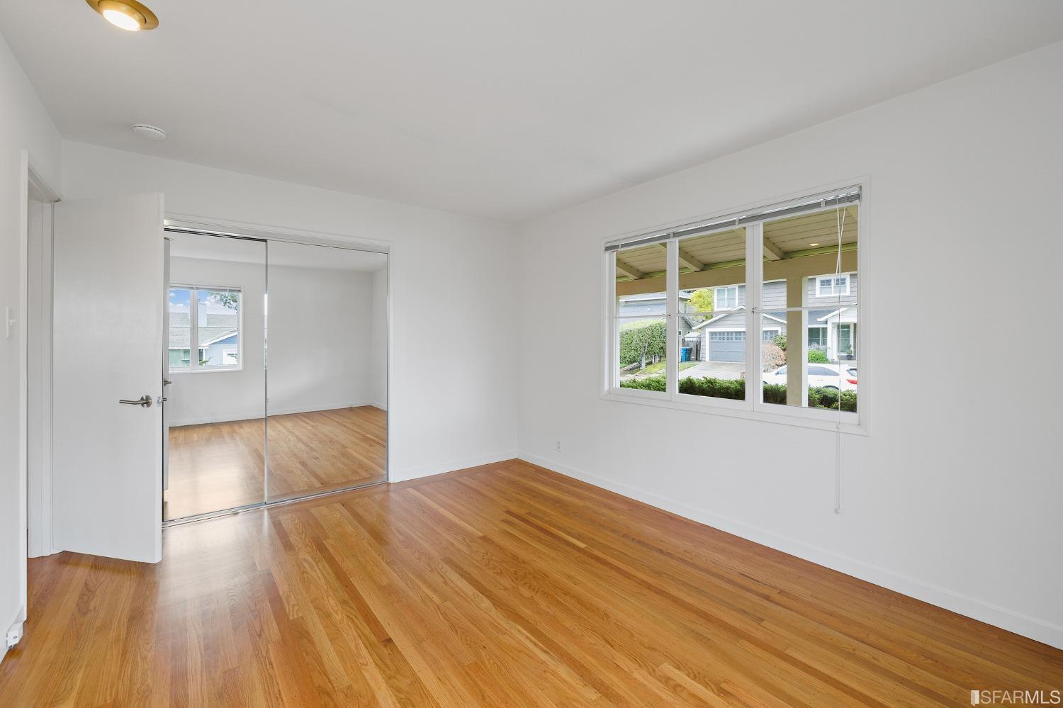3101 Sunset Terrace San Mateo, CA 94403 - Photo 13 of 24 a view of empty room with wooden floor and fan