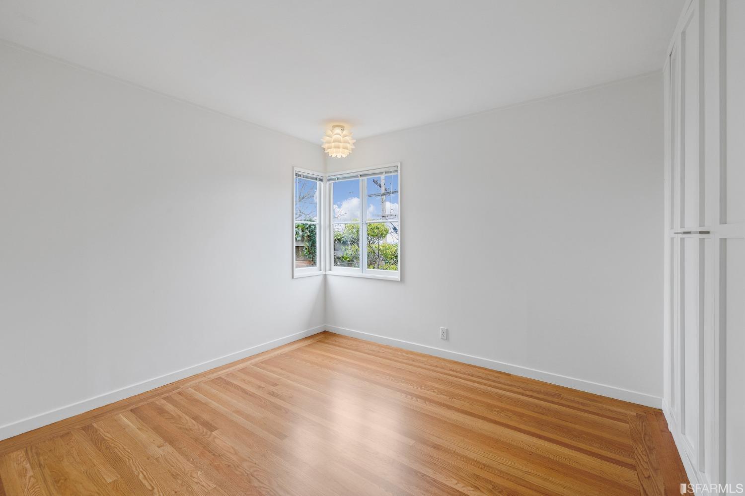 3101 Sunset Terrace San Mateo, CA 94403 - Photo 15 of 24 an empty room with wooden floor and windows
