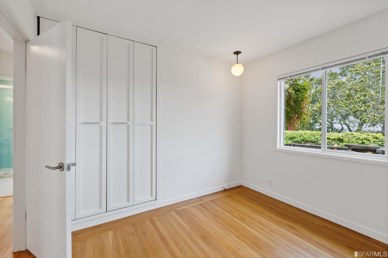 3101 Sunset Terrace San Mateo, CA 94403 - Photo 18 of 24 a view of empty room with wooden floor and fan