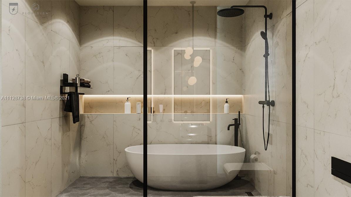 5850 Alton Road Miami Beach, FL 33140 - Photo 19 of 27 a bathroom with a bathtub and shower