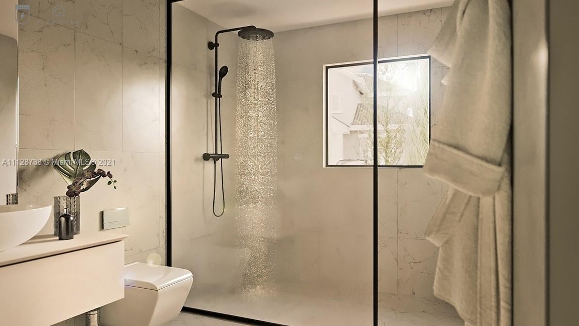 5850 Alton Road Miami Beach, FL 33140 - Photo 10 of 27 a bathroom with a shower and toilet