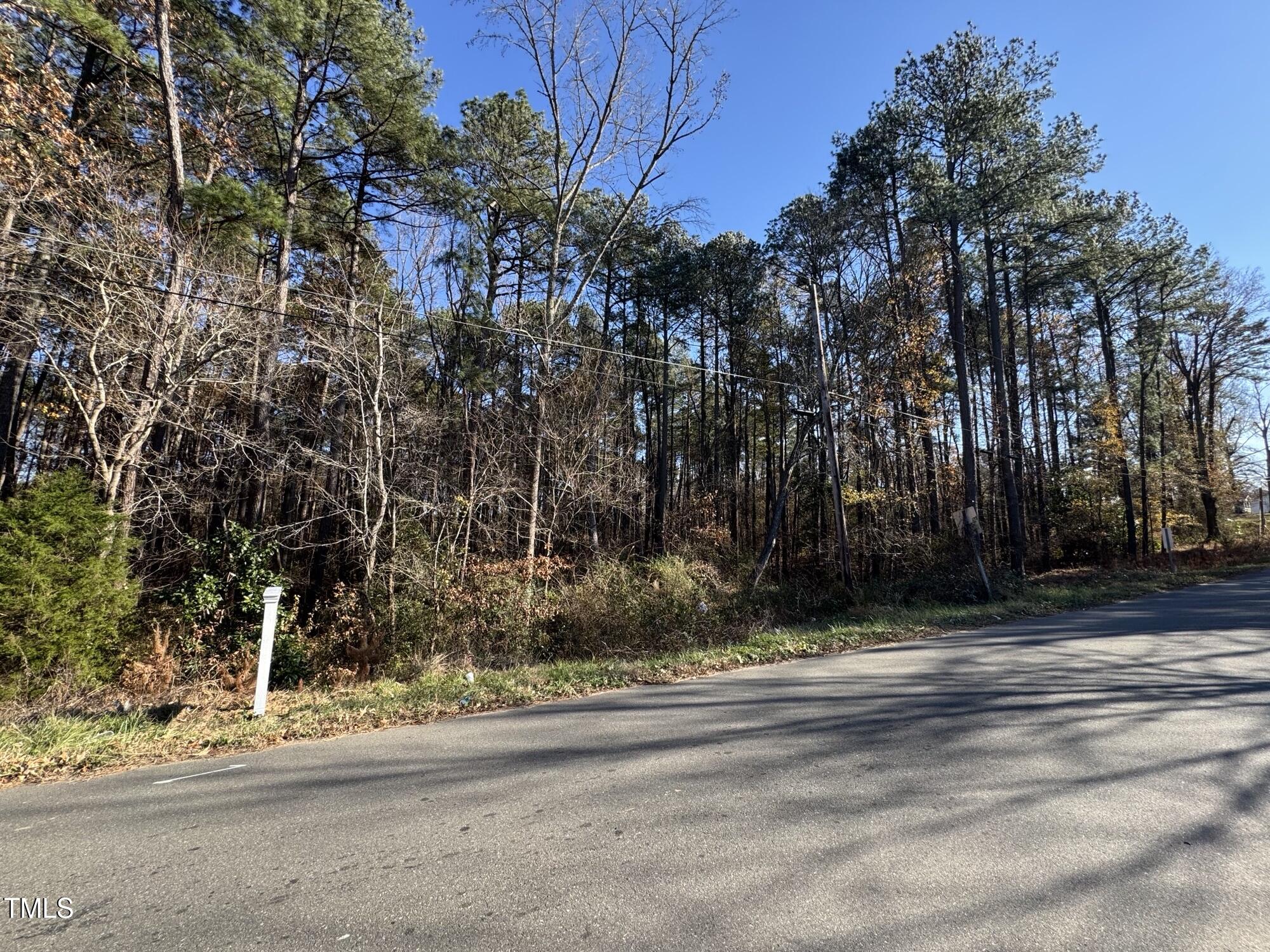3024-3026 Ruth Street Durham, NC 27704 - Photo 7 of 11 a view of a house with a yard and tree s