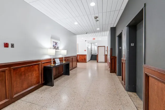 a kitchen with stainless steel appliances a refrigerator and a stove