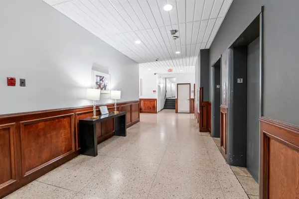 a kitchen with stainless steel appliances a refrigerator and a stove