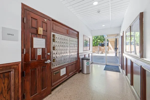 a view of a porch with chairs and couches