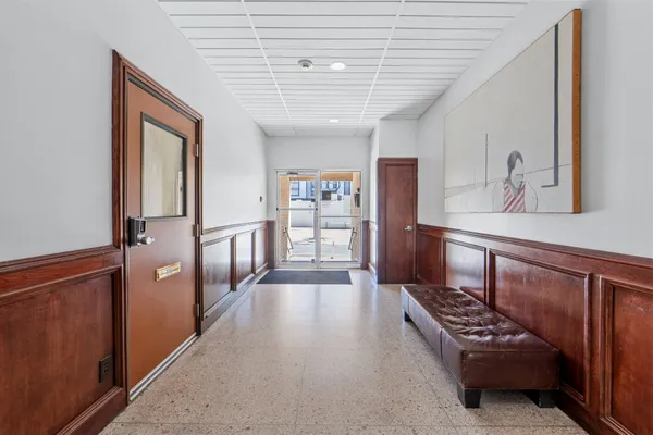 a view of wooden floor and chandelier in a room