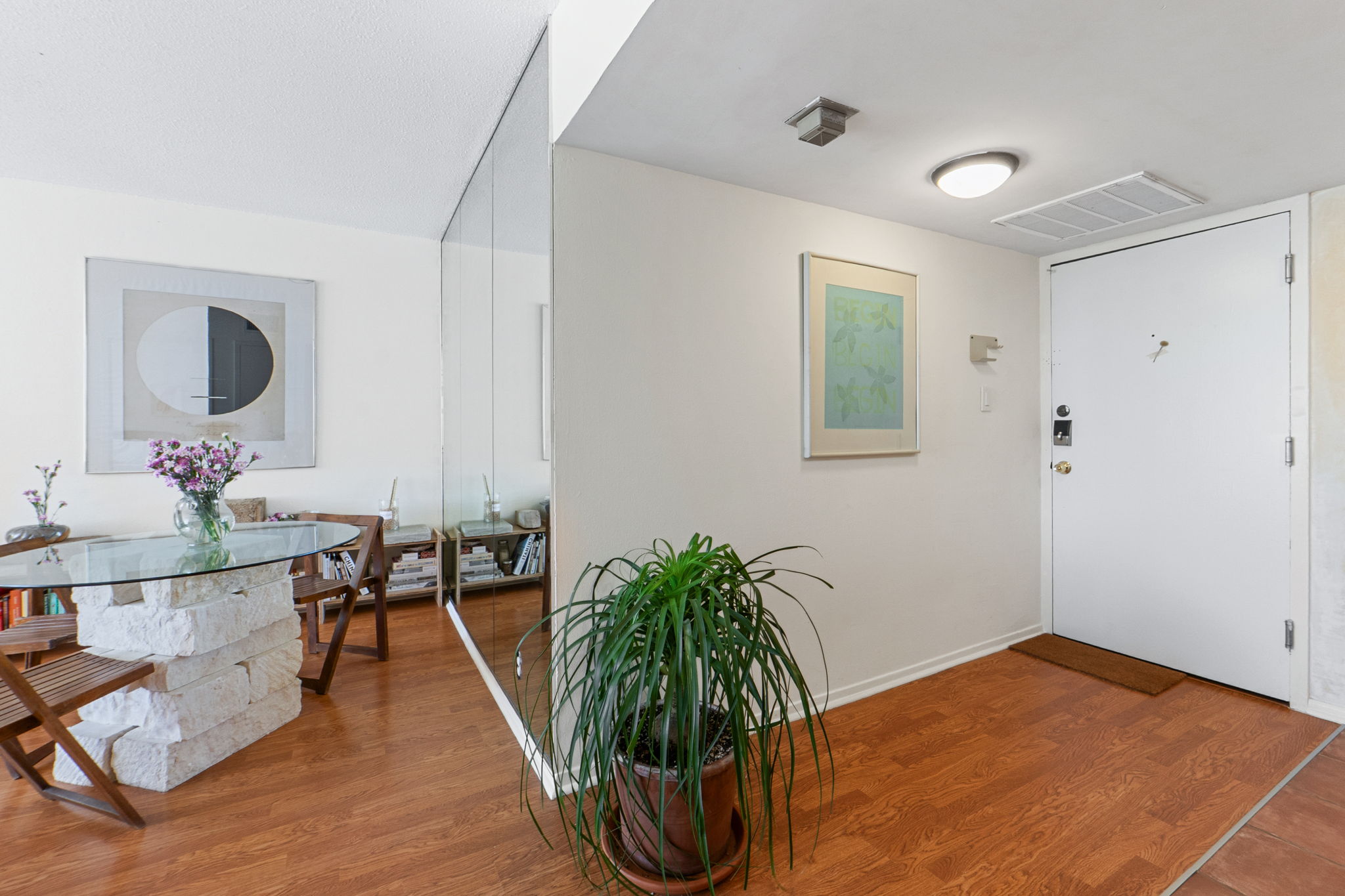 1800 Lavaca Street, Unit 413 Austin, TX 78701 - Photo 2 of 17 Foyer featuring wood finished floors and baseboards