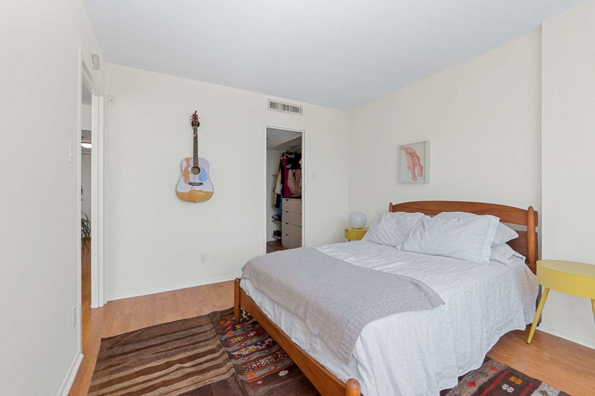 1800 Lavaca Street, Unit 413 Austin, TX 78701 - Photo 7 of 17 Bedroom with wood finished floors and a spacious closet