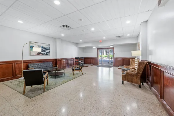 a living room with furniture and a table
