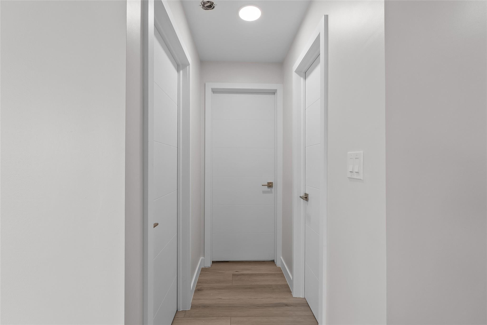 1150 East Sample Road, Unit 202 Pompano Beach, FL 33064 - Photo 17 of 20 a view of a hallway with wooden floor