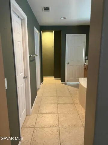 a bathroom with a sink and cabinets