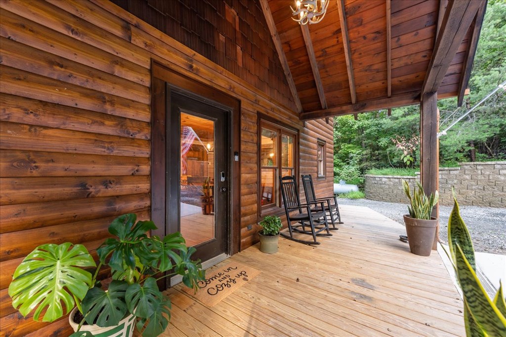 126 Brookwood Drive Blue Ridge, GA 30513 - Photo 12 of 84 a view of a patio with a table chairs and a potted plant