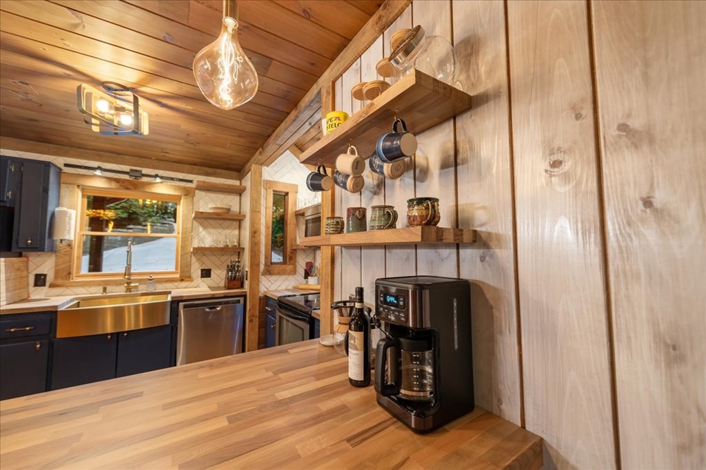 126 Brookwood Drive Blue Ridge, GA 30513 - Photo 38 of 84 a kitchen with stainless steel appliances granite countertop a refrigerator and a sink