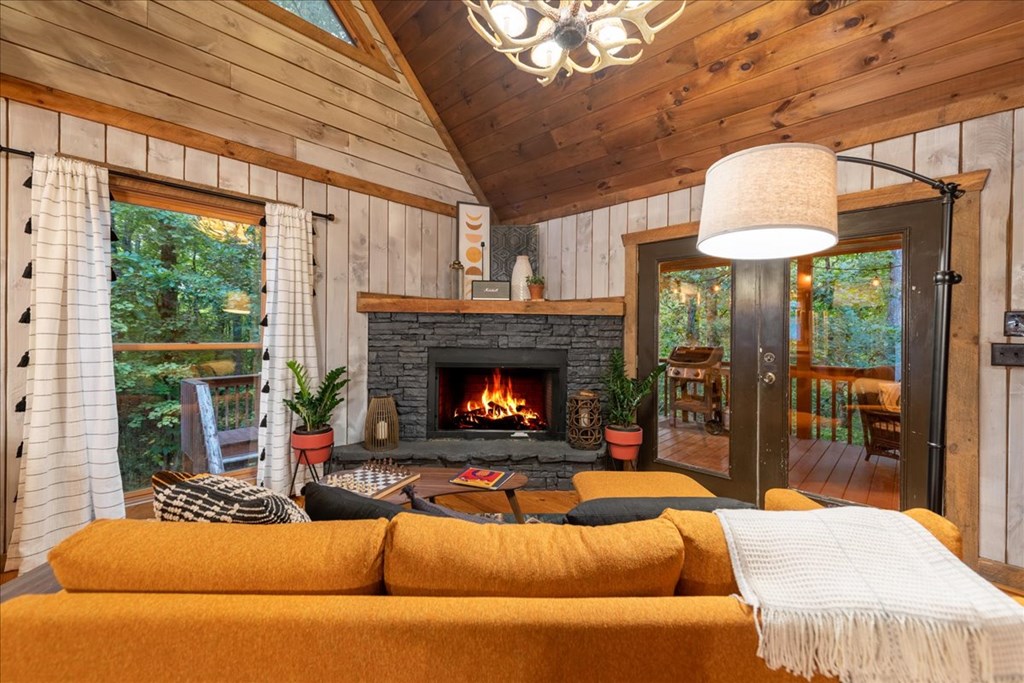 126 Brookwood Drive Blue Ridge, GA 30513 - Photo 39 of 84 a living room with furniture and a fireplace