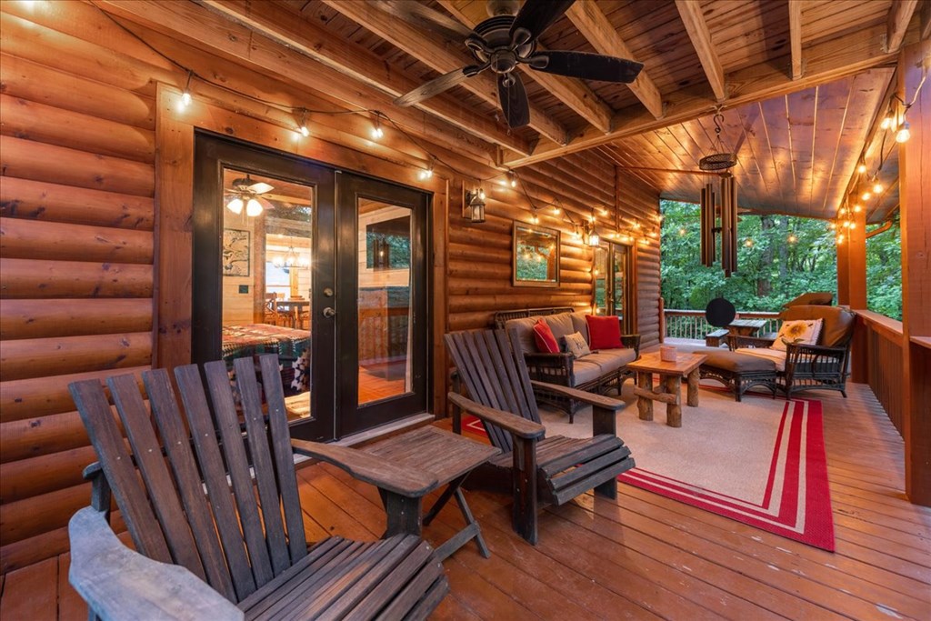 126 Brookwood Drive Blue Ridge, GA 30513 - Photo 49 of 84 a living room with furniture a wooden floor and next to a window