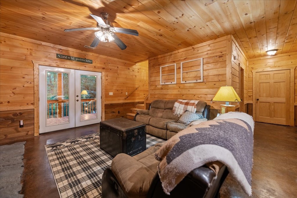 126 Brookwood Drive Blue Ridge, GA 30513 - Photo 71 of 84 a living room with furniture and large windows