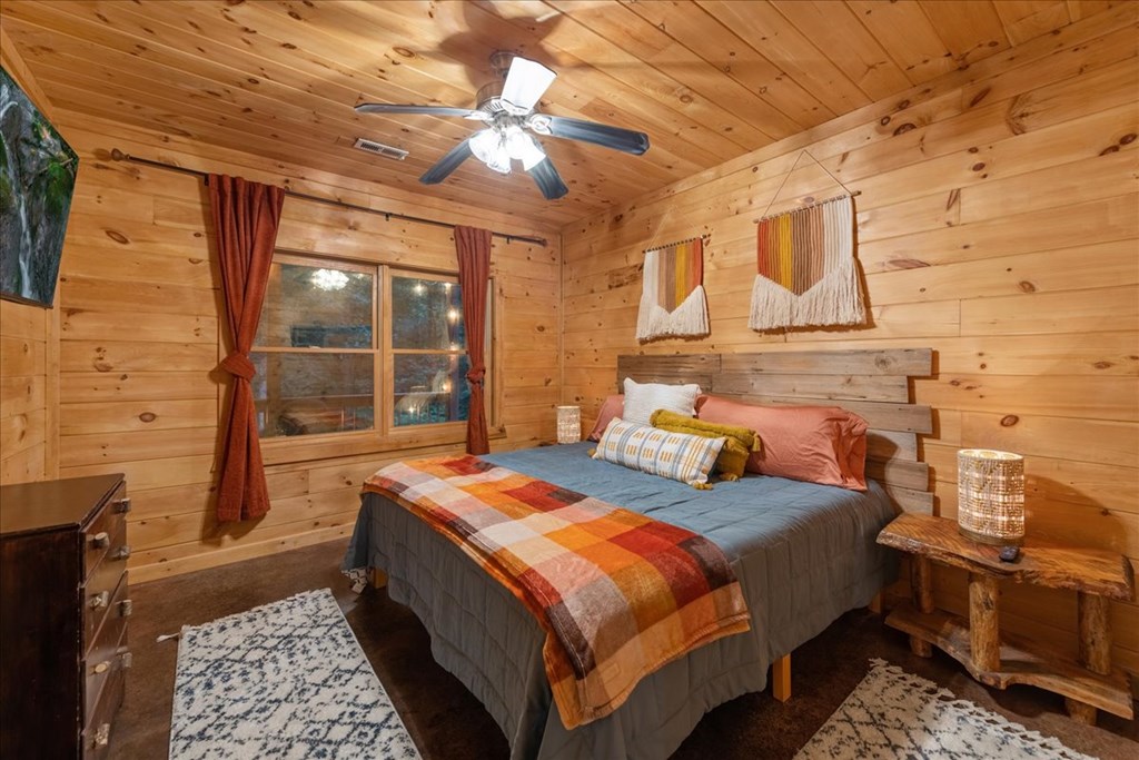 126 Brookwood Drive Blue Ridge, GA 30513 - Photo 74 of 84 a bed room with a bed and wooden floor