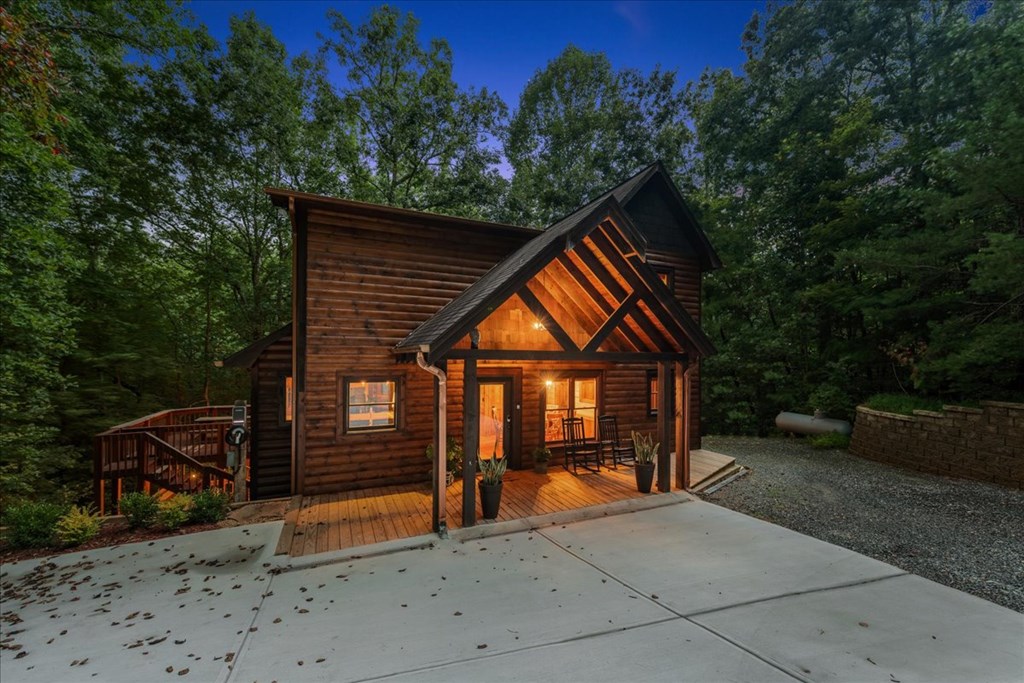 126 Brookwood Drive Blue Ridge, GA 30513 - Photo 77 of 84 a backyard of a house with wooden floor and outdoor seating