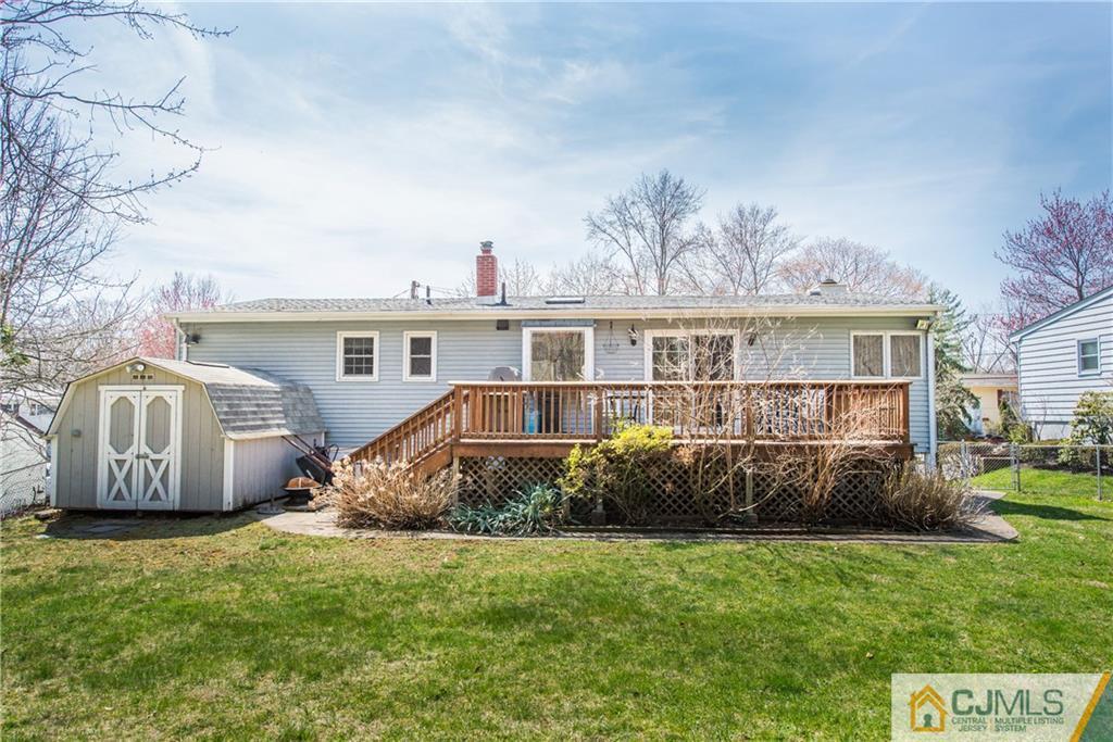 4 Peake Road Edison, NJ 08837 - Photo 23 of 25 a view of a house with backyard and sitting area