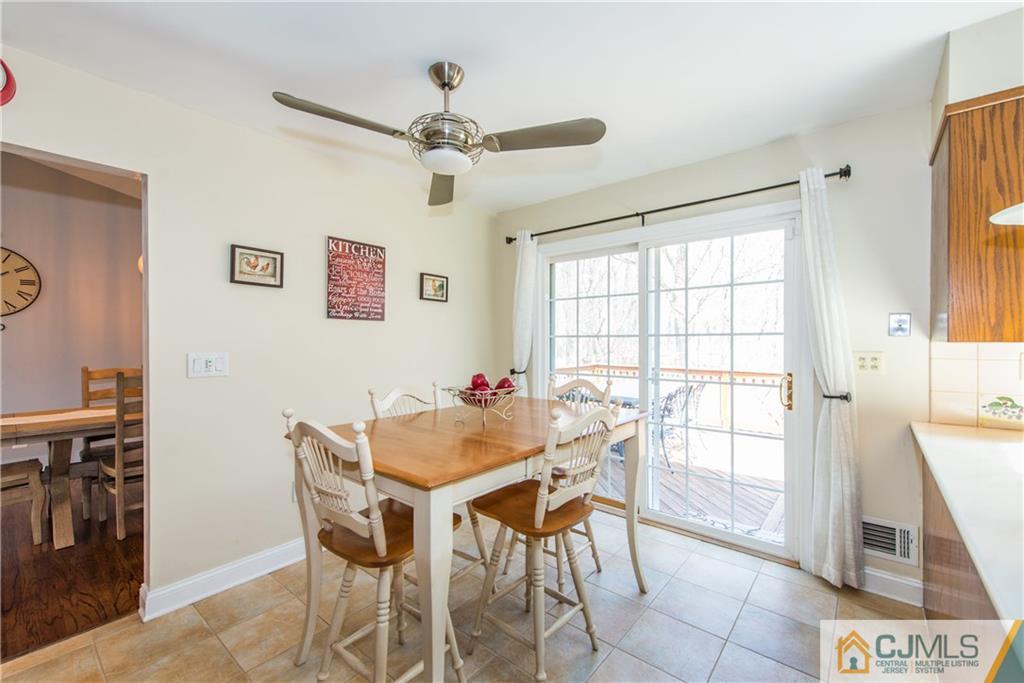 4 Peake Road Edison, NJ 08837 - Photo 8 of 25 a view of a dining room with furniture and a chandelier