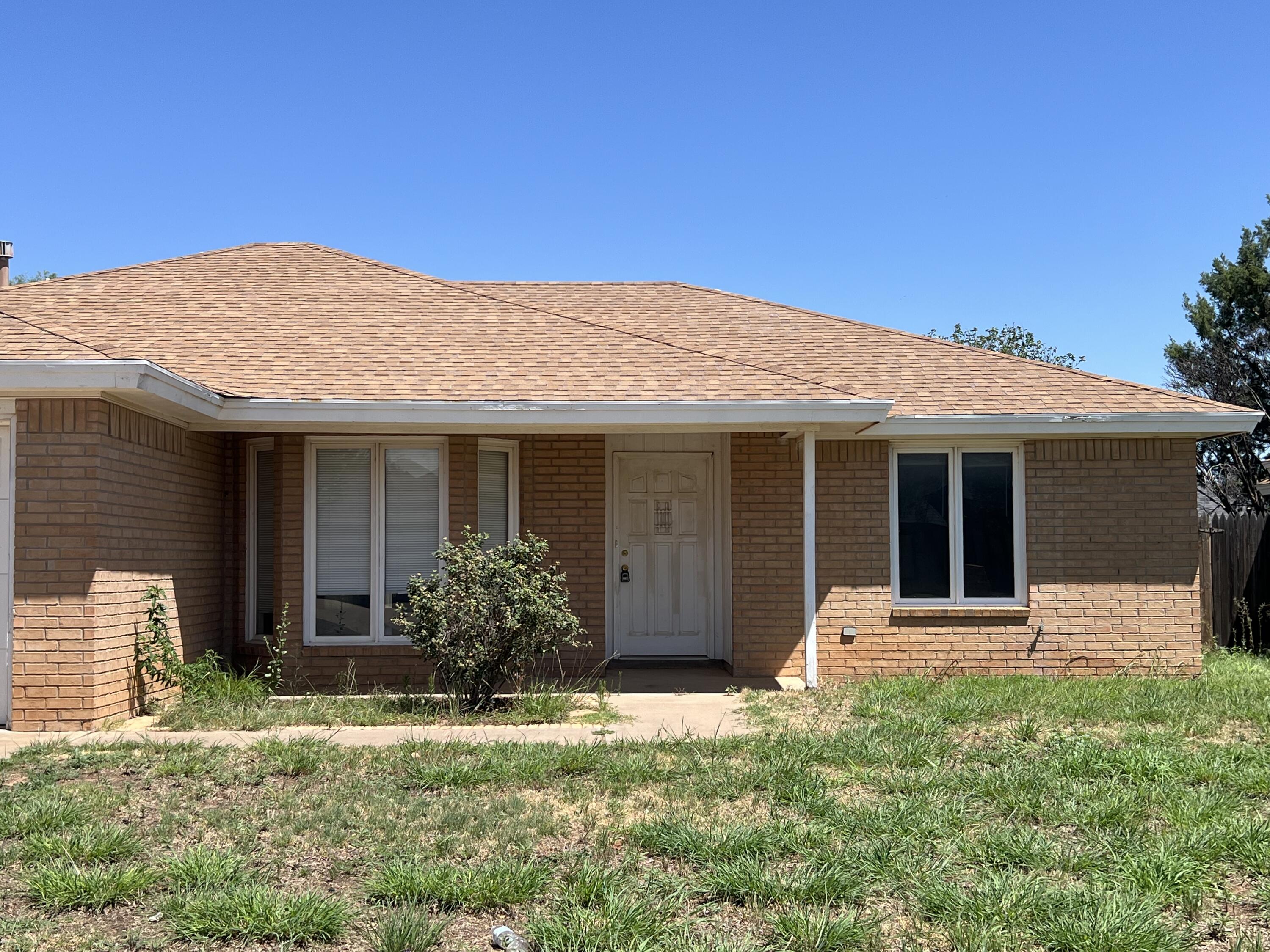 5522 95th Street Lubbock, TX 79424 - Photo 1 of 26 front view of a house with a yard