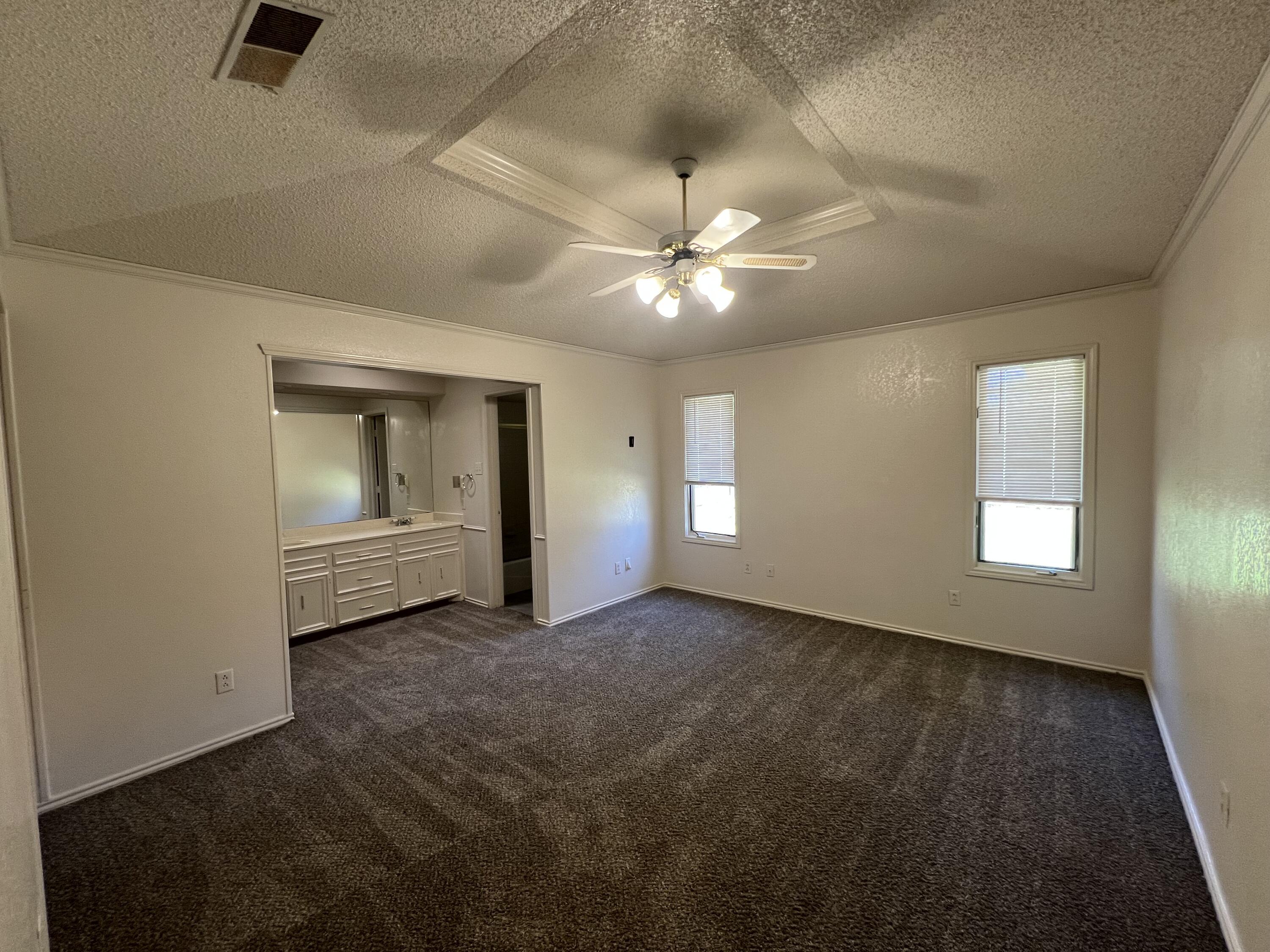 5522 95th Street Lubbock, TX 79424 - Photo 11 of 26 a view of an empty room with a window
