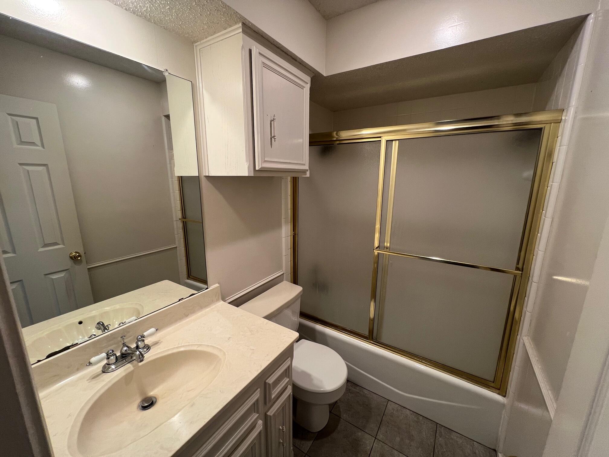 5522 95th Street Lubbock, TX 79424 - Photo 20 of 26 a bathroom with a sink toilet and shower