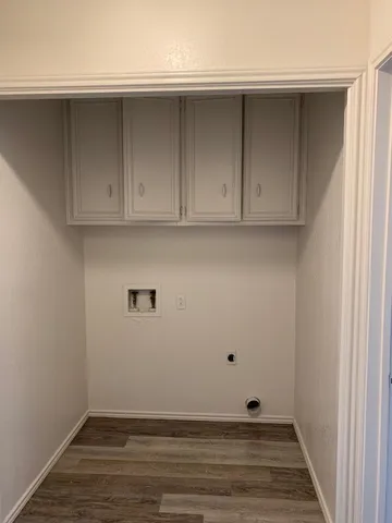 a view of room with hardwood floor