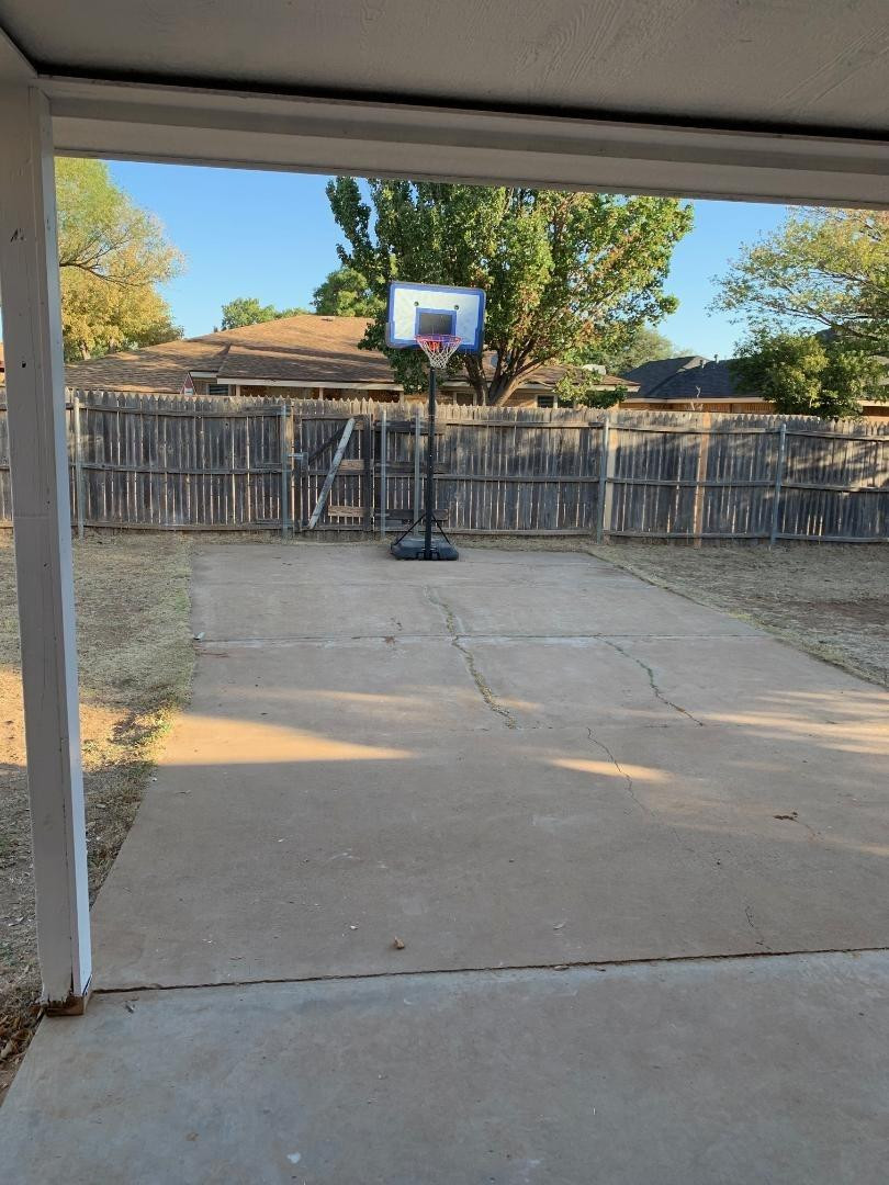 5522 95th Street Lubbock, TX 79424 - Photo 25 of 26 a view of a porch with furniture and floor to ceiling window