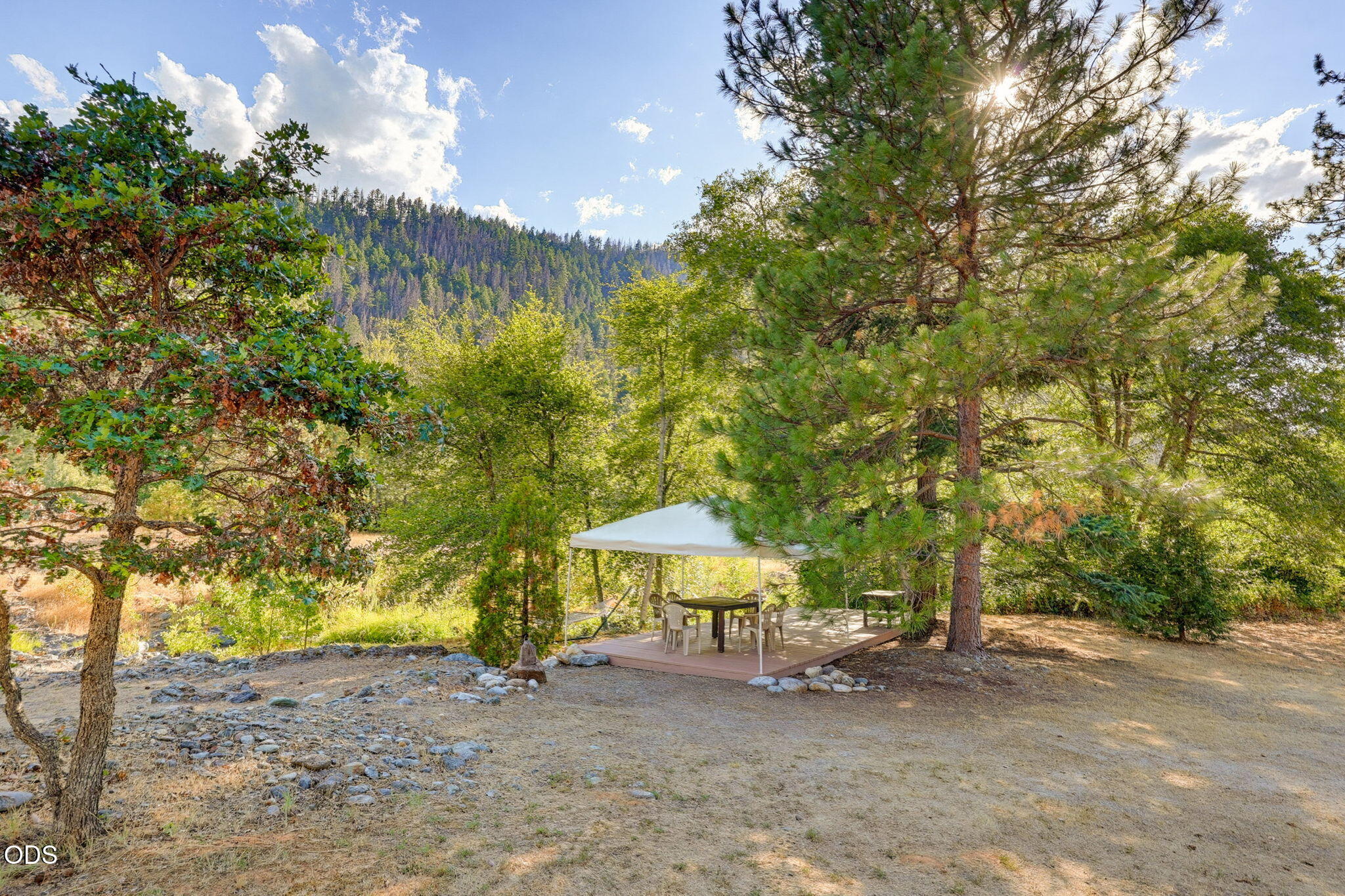 2459 Little Applegate Road Jacksonville, OR 97530 - Photo 63 of 86 a backyard of a house with table and chairs