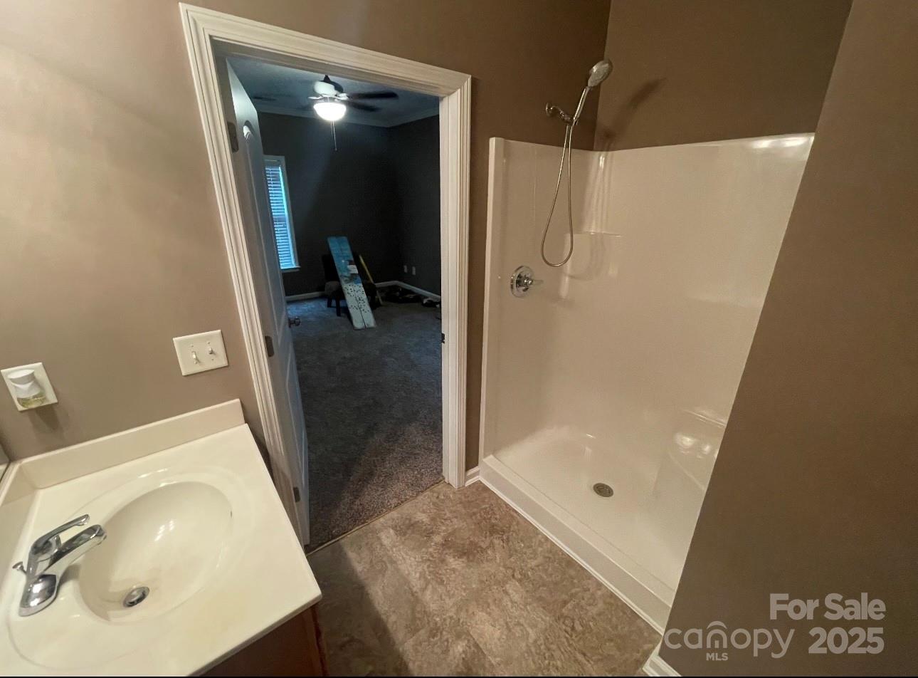 5430 Forester Drive High Point, NC 27265 - Photo 16 of 21 a bathroom with a sink a toilet and shower
