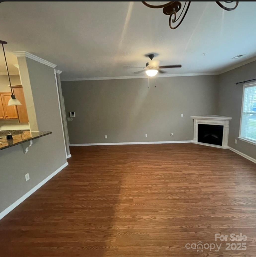 5430 Forester Drive High Point, NC 27265 - Photo 5 of 21 a view of a livingroom with a fireplace and a ceiling fan