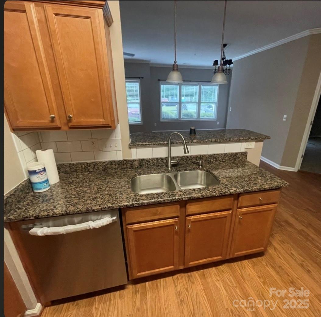 5430 Forester Drive High Point, NC 27265 - Photo 9 of 21 a kitchen with stainless steel appliances granite countertop wooden cabinets a sink and dishwasher