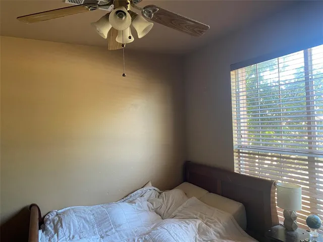 a view of livingroom with hardwood floor and a ceiling fan