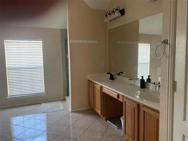 a view of a terrace with a garden and trees