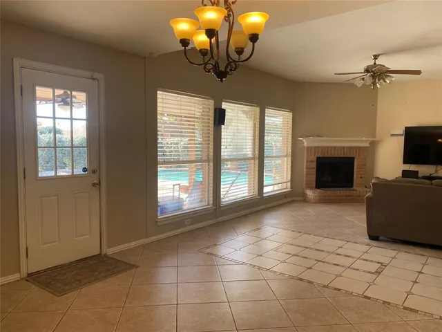 a kitchen with granite countertop a sink a window stainless steel appliances and cabinets