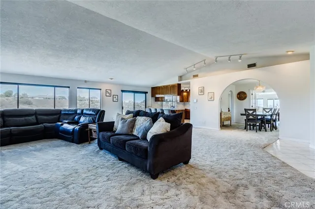 a living room with furniture and a rug
