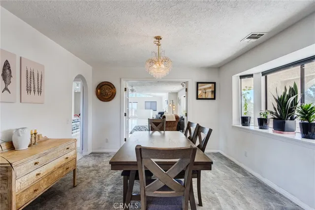 a bathroom with a sink a toilet a shower and a mirror