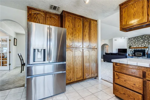a bathroom with a double vanity sink toilet and shower