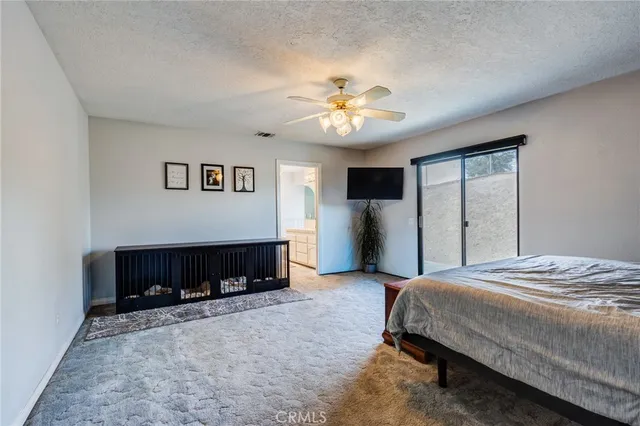 a view of a terrace with furniture and umbrella