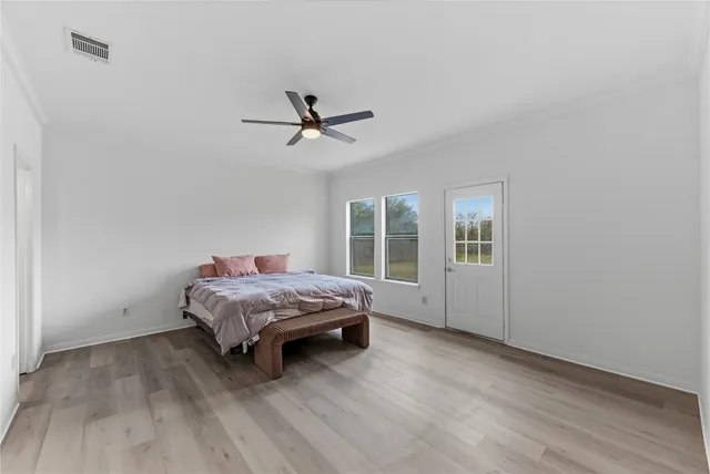 a living room with a bed furniture and a window