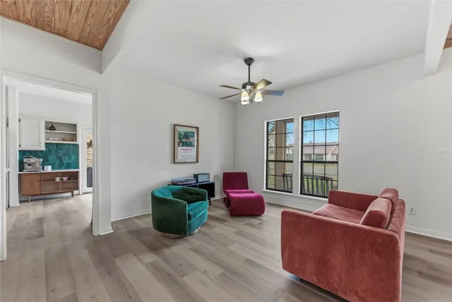 a living room with furniture and a window