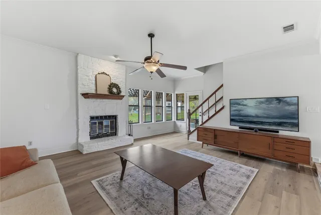a living room with furniture and a fireplace