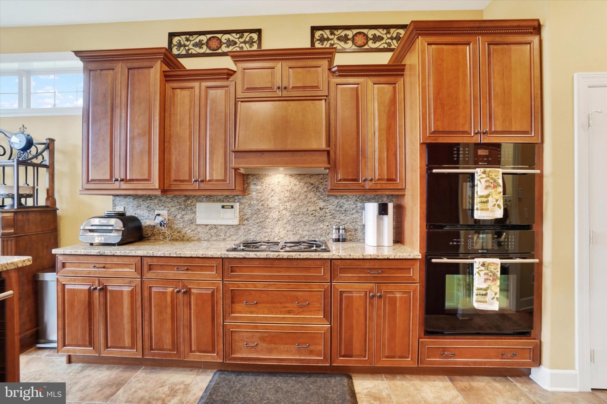 10 Azalea Drive Windsor, PA 17366 - Photo 15 of 36 Warm wooden cabinetry in a modern kitchen.