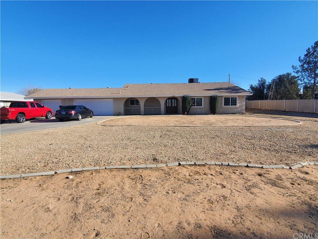 13833 Jicarilla Road Apple Valley, CA 92307 - Photo 1 of 1 a view of a house with a yard