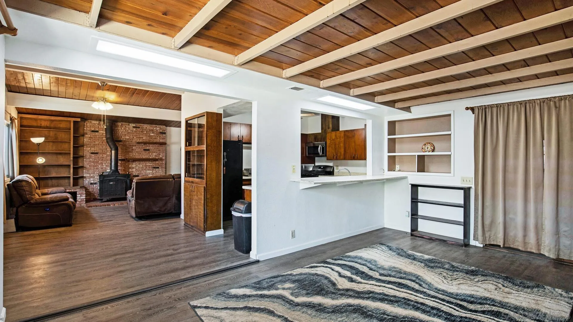 9243 Los Coches Road Lakeside, CA 92040 - Photo 15 of 30 a view of a hardwood floor and a ceiling fan in kitchen