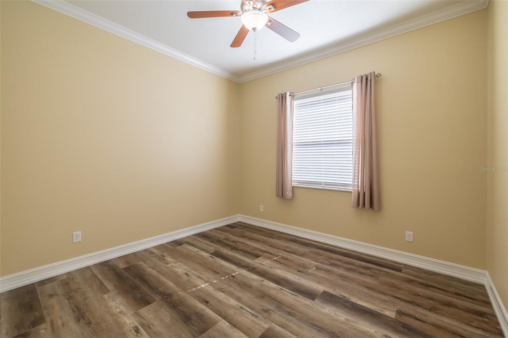16122 Cedar Key Drive Wimauma, FL 33598 - Photo 14 of 98 a view of room with window and ceiling fan