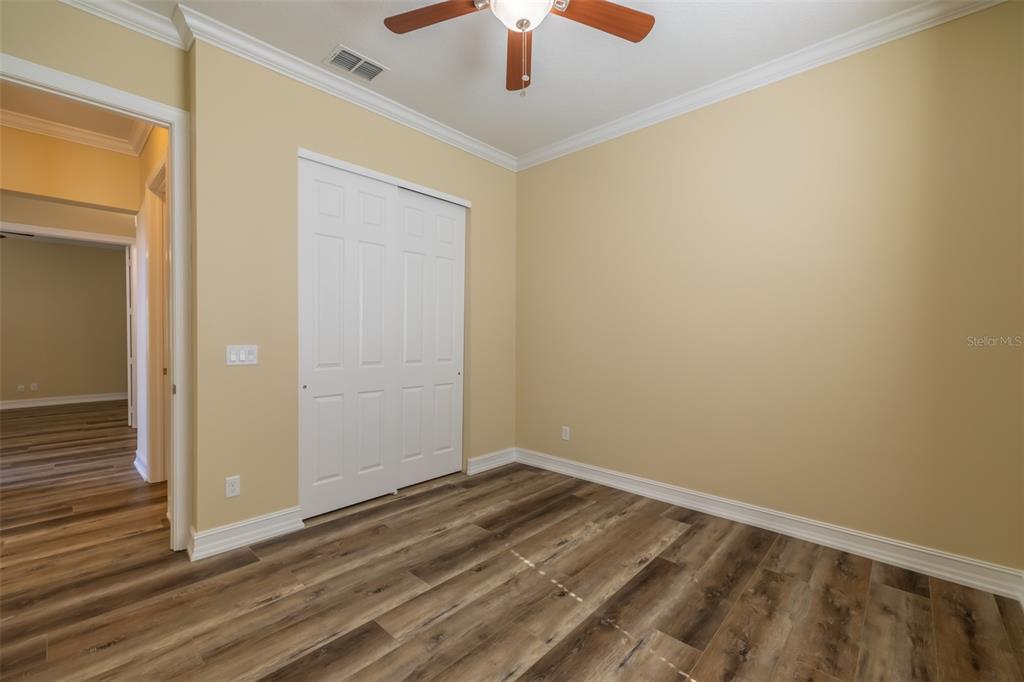 16122 Cedar Key Drive Wimauma, FL 33598 - Photo 15 of 98 a view of room with wooden floor