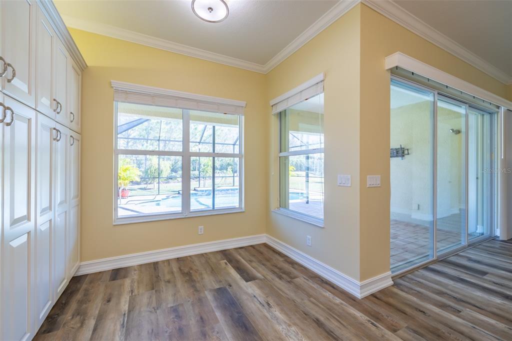 16122 Cedar Key Drive Wimauma, FL 33598 - Photo 30 of 98 a view of an empty room with glass door and windows